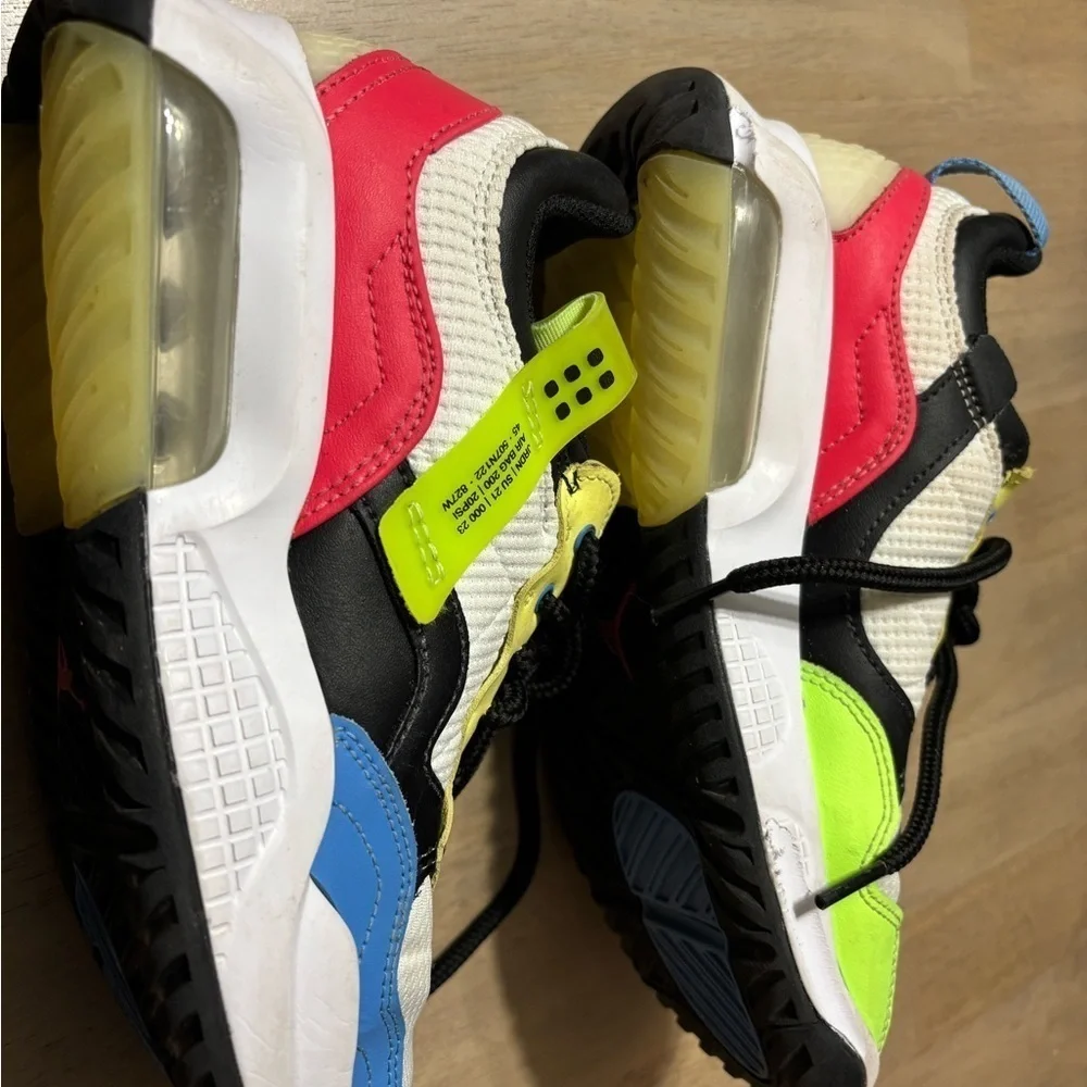 Nike Air Jordan’ size 6 Youth white, black, blue, yellow, pink.
